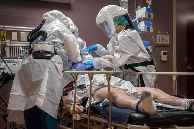 December 11, 2020, USA: From left, Registered Nurses Mandy Cordova, left and Mikayla Salazar, right, help Dr. James Gonzales put a breathing tube for a respirator into a COVID-19 patient at Guadalupe County Hospital in Santa Rosa, Friday December 11, 2020. The patient is an inmate at Guadalupe County Corrections and was brought in Thursday. They said he should have been transferred to Albuquerque then but they couldn t get a medical helicopter because of weather. A ambulance arrived later from Albuquerque to transport the man to Lovelace Medical Center. USA - ZUMAab1_ 20201211_zaf_ab1_012 Copyright: xEddiexMoorex