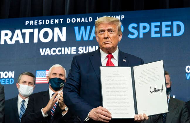 United States of America: U.S President Donald Trump, joined by Vice President Mike Pence holds up a signed Executive Order on access to vaccines at the Operation Warp Speed Vaccine Summit in the South Court Auditorium at the Eisenhower Executive Office Building at the White House 8, 2020 in Washington, D.C. Washington United States of America - ZUMAp138 20201208_zaa_p138_012 Copyright: xShealahxCraighead WhitexHousex