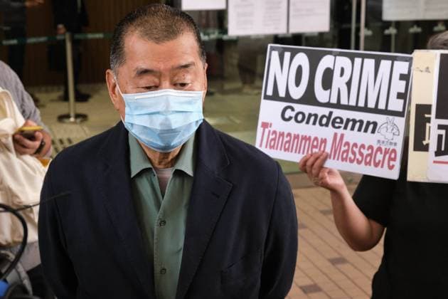 November 3, 2020, Hong Kong, China: A supporter holds a placard saying No Crime Condemn Tiananmen Massacre as pro-democracy media tycoon Jimmy Lai arrives at West Kowloon Magistrates Court. 26 Hong Kong pro-democracy activists including media tycoon Jimmy Lai and Joshua Wong appear in court after being charged with participating in or inciting others to take part in an illegal assembly related to a banned June 4 vigil commemorating the Tiananmen Sqaure crackdown. Hong Kong China - ZUMAs197 20201103_zaa_s197_016 Copyright: xIsaacxWongx