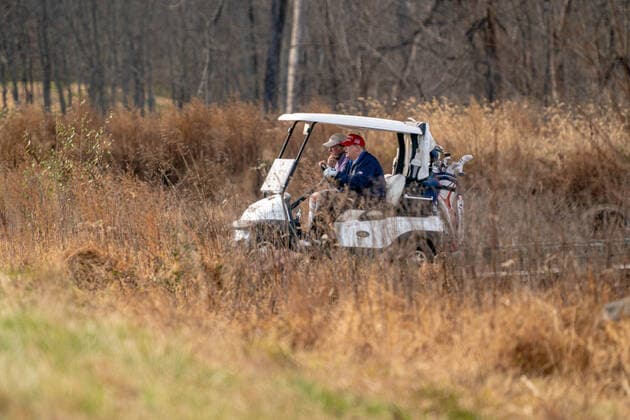 United States President Donald J. Trump drives his golf cart, number 45, as he plays golf at Trump National Golf Club in Sterling, Virginia on Sunday, December 13, 2020.  WAP20201213503 KenxCedeno