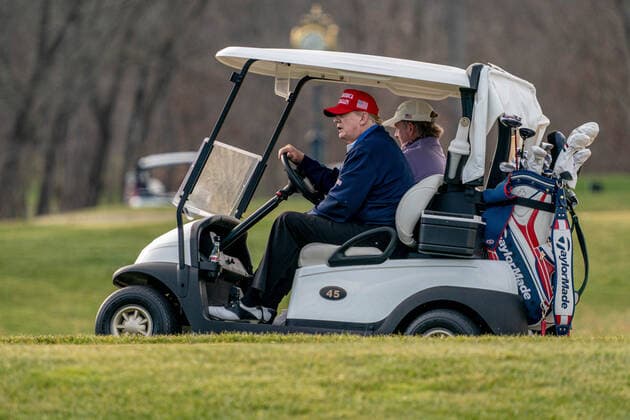 United States President Donald J. Trump drives his golf cart, number 45, as he plays golf at Trump National Golf Club in Sterling, Virginia on Sunday, December 13, 2020.  WAP20201213506 KenxCedeno