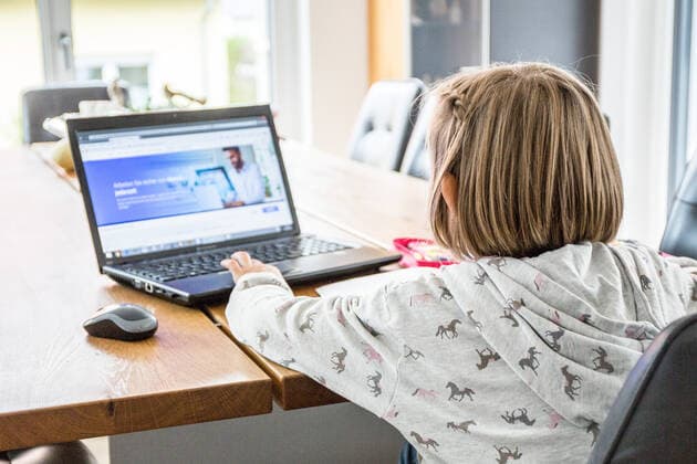 Bamberg, Germany 13 December 2020 A schoolchild sits at a table in an apartment and works with a laptop and solves homeschooling tasks Bavaria Copyright: xFotostandx xK.xSchmittx