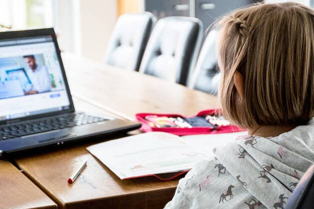 Bamberg, Germany 13 December 2020 A schoolchild sits at a table in an apartment and works with a laptop and solves homeschooling tasks Bavaria Copyright: xFotostandx xK.xSchmittx