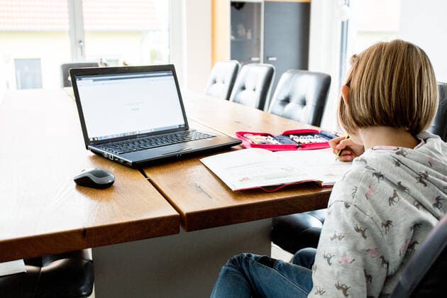Bamberg, Germany 13 December 2020 A schoolchild sits at a table in an apartment and works with a laptop and solves homeschooling tasks Bavaria Copyright: xFotostandx xK.xSchmittx