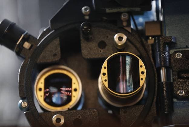 MOSCOW, RUSSIA â€“ DECEMBER 14, 2020: An old film camera is on display in the Khudozhestvenny Cinema at Arbatskaya Square. The cinema, a Russian regional level heritage site and one of the worldâ€™s three surviving cinemas older than 100 years, was designed by Nikolai Blagoveshchensky and completed in 1909 to become the first detached cinema building in Russia. In 1912 it was redesigned by Fyodor Snhenhtel to increase its capacity. The cinema closed for renovation in 2014 and is expected to re-open by the end of 2020. The renovation included the restoration of valuable original features lost in the 1960s, and other original elements of the facade, the auditorium and the foyer. The cinemaâ€™s facade and the original lamps at the main entrance have  TS0F18FD
