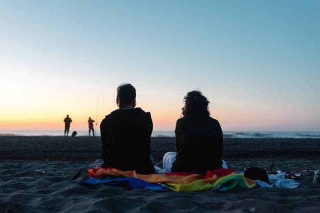 Cheerful girlfriends spending time together on sandy beach in daylight, Model released Copyright: xAlbertoxMenendezx MR