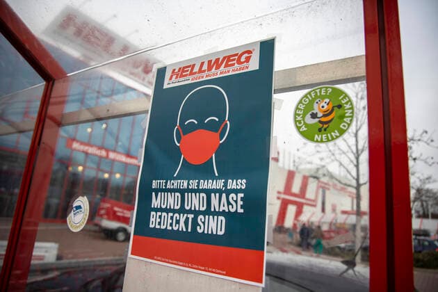 Mask duty notice at Hellweg in Berlin on 15 December 2020 A large number of people are out and about in the city today ahead of the hard lockdown coming into effect tomorrow with the closure, of retail, DIY stores, hairdressers etc Last day before the hard lockdown in Berlin