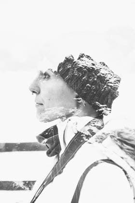 Double exposure black and white mountains and portrait of confident female in profile with nose piercing dressed in winter hat and jacket, Model released Copyright: xAlbertoxMenendezx MR