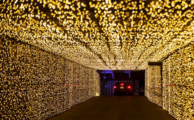 (201216) -- TORONTO, Dec. 16, 2020 -- Visitors drive their cars to go through a light tunnel at the Christmas-themed drive-thru light show Polar Drive in Toronto, Canada, Dec. 15, 2020. (Photo by Xinhua) CANADA-TORONTO-COVID-19-DRIVE-THRU-LIGHT SHOW ZouxZheng 