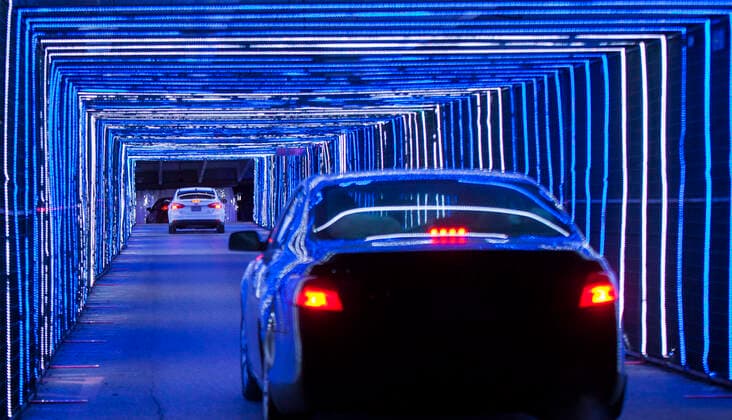 (201216) -- TORONTO, Dec. 16, 2020 -- Visitors drive their cars to go through a light tunnel at the Christmas-themed drive-thru light show Polar Drive in Toronto, Canada, Dec. 15, 2020. (Photo by Xinhua) CANADA-TORONTO-COVID-19-DRIVE-THRU-LIGHT SHOW ZouxZheng 