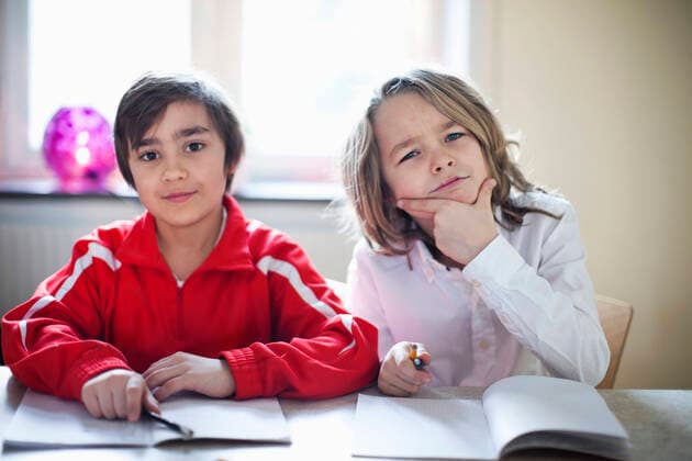 Portrait of students studying in classroom , model released Copyright: xMaskotx , MA32232