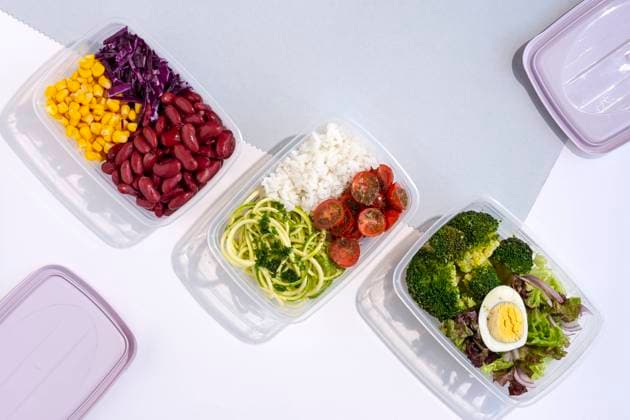 Homemade vegan food in lunch boxes with healthy vegetable fresh from above. Vegan food concept. Healthy food. Flat lay. Top view Copyright: xEduardoxLopezx Model Released