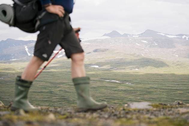 Low section of hiker walking against mountains , model released Copyright: xKentarooxTrymanx , MA49913