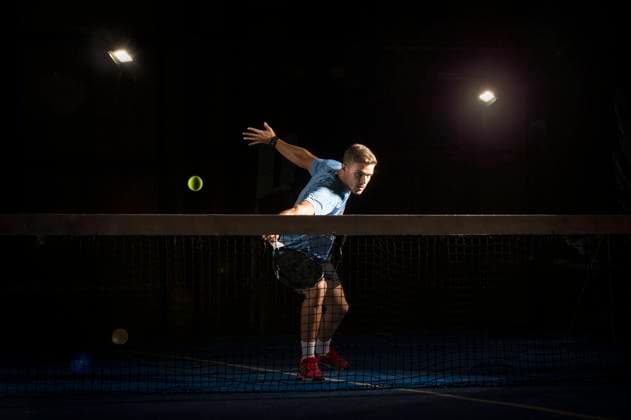 Man playing padel in darkness Copyright: xFranxRosadox Model Released