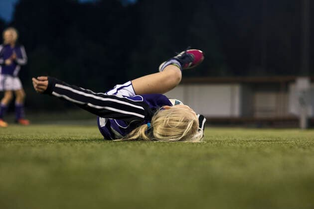 Surface level view of fallen athlete on soccer field , model released Copyright: xMaskotx , MA55658