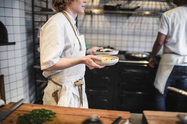 Midsection of waitress carrying food plates in kitchen at restaurant , model released, property released Copyright: xMaskotx , MA61498