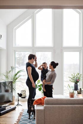 Mothers talking to daughter while standing in living room at home , model released, property released Copyright: xMaskotx , MA63081