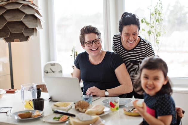 Cheerful mothers looking at daughter having breakfast on dining table , model released, property released Copyright: xMaskotx , MA63123