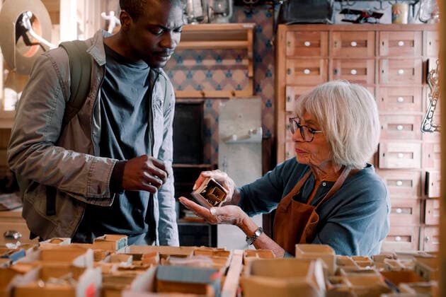 Senior saleswoman assisting male customer with nails at hardware store , model released, property released Copyright: xMaskotx , MA73237