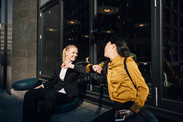 Women greeting using elbows , model released Copyright: xMaskotx , MA78495