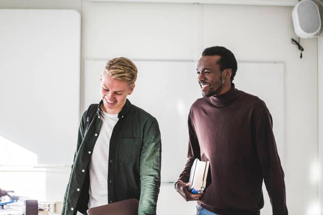 Smiling young male students in university classroom Sweden, Stockholm, model released, property released Copyright: xMaskotx , MA79893