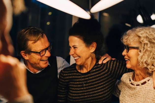 Cheerful senior male and female friends enjoying dinner party at home Sweden, Stockholm, model released, property released Copyright: xMaskotx , MA79975