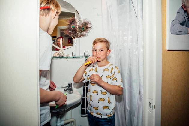 Portrait of boy brushing teeth in morning Sweden, Stockholm, model released, property released Copyright: xMaskotx , MA81048