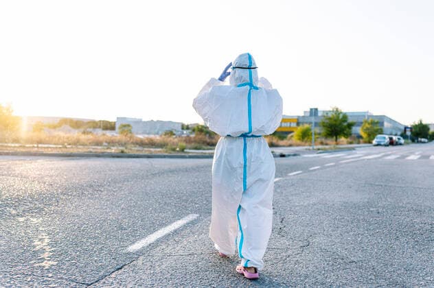 Nurse wearing protective wear while walking on street in city model released Symbolfoto PGF00122