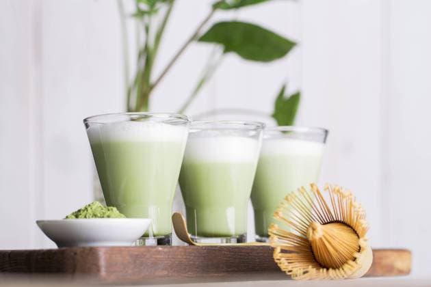 Preparing matcha latte beverage Copyright: xRamonxLopezx Model Released