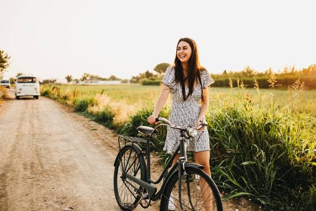 Woman with bicycle in countryside, Model released Copyright: xJakexJakabx MR