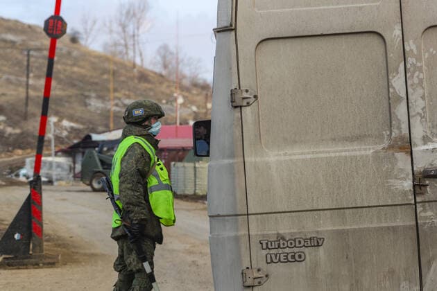 Russian peacekeepers checkpoint is pictured on the road from Goris to Stepanakert throughout Lachin Corridor, outside the city of Shusha, in the self-proclaimed Nagorno-Karabakh Republic on Tuesday, Dec 22, 2020. Russian peacekeepers control the five-kilometre-wide Lachin corridor, which provides communication between Nagorno-Karabakh and Armenia, the safe return of people to their places of residence, and the movement of civilian vehicles. The corridor is a mountain pass connecting Armenia and the enclave of Nagorno-Karabakh. The corridor is de jure in the Lachin District of Azerbaijan, but de facto in the Kashatagh Province of the self-proclaimed Republic of Artsakh. It contains the town of Lachin and the villages of Zabux and Sus. (Photo  , Copyright: xVudixXhymshitix