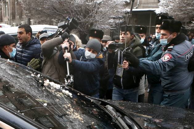 YEREVAN, ARMENIA - DECEMBER 24, 2020: People stage a protest outside the House of the Government demanding the resignation of Armenia s Prime Minister Nikol Pashinyan. On 9 November, Armenia s Prime Minister Nikol Pashinyan, Russia s President Vladimir Putin and Azerbaijan s President Ilham Aliyev signed an agreement on a complete ceasefire in the disputed Caucasus region of Nagorno-Karabakh, sparking mass protests in Armenia. Hayk Baghdasaryan Photolure TASS  TS0F2A2C