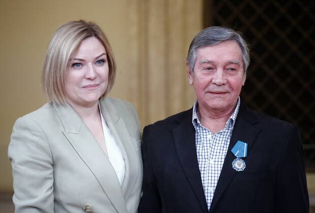 MOSCOW, RUSSIA - DECEMBER 24, 2020: Russia s Culture Minister Olga Lyubimova (L) and Igor Moiseyev State Academic Folk Dance Ensemble ballet tutor Viktor Nikitushkin awarded an Order of Honor during a ceremony at the Beethoven Concert Hall of the Bolshoi Theater. Artyom Geodakyan TASS  TS0F2B3C