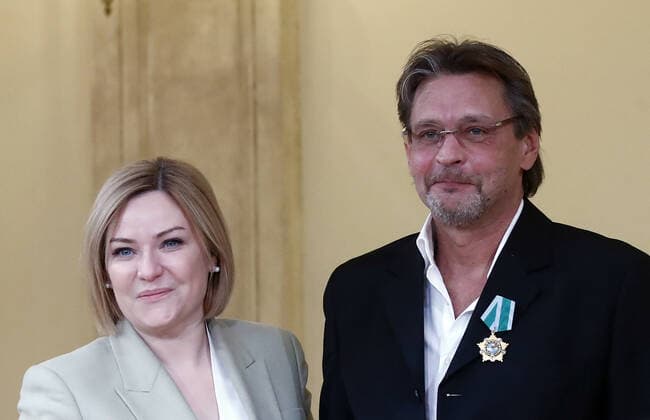 MOSCOW, RUSSIA - DECEMBER 24, 2020: Russia s Culture Minister Olga Lyubimova (L) and actor Alexander Domogarov awarded an Order of Friendship during a ceremony at the Beethoven Concert Hall of the Bolshoi Theater. Artyom Geodakyan TASS  TS0F2B3F
