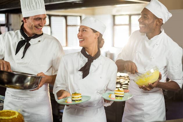 Chefs preparing a dessert Chefs preparing a dessert in commercial kitchen, model released30s, Mid Adult, Man, Male, Caucasian, 20s, Young Adult, Woman, Female, Black, Chef, Chefs Whites, Head Chef, Chefs Hat, Uniform, Profession, Professional, Occupation, Job, Worker, Standing, Holding, Smiling, Cheerful, Colleague, Coworker, Team, Teamwork, Mixing, Making, Garnish, Mixing Bowl, Bowl, Dough, Egg Whipper, Dish, Cake, Dessert, Sweet, Plate, Gourmet, Working, Preparation, Preparing, Food, Kitchen Worktop, Commercial Kitchen, Delicious, Cuisine, Industry, Restaurant, Hotel, Catering, Happy, Expertise, Service, Together, Variety, Indoors 