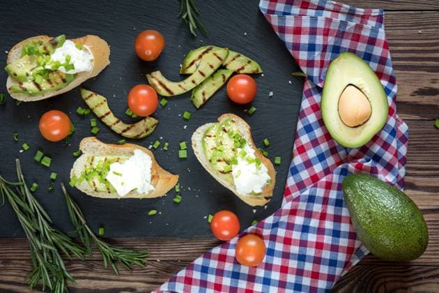 Bread with slices of avocado and cream cheese Bread with slices of grilled avocado and cream cheese on a black cutting stone board. Fresh parsley and rosemary. Vegetarian, vegan concept.avocado, toast, cream, cheese, food, bread, sandwich, green, white, healthy, fruit, meal, vegetable, snack, gourmet, lunch, breakfast, appetizer, delicious, natural, fresh, health, diet, tasty, dinner, vegetarian, slice, eating, tomato, raw, burger, butty, calories, cooking, dark, dietary, dietetic, genetically, organic, seasonal, seeds, spoon, spring, summer, vegan, vegetables,  Copyright: xViktoriaxKondysenkox 26168268