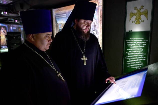 VLADIVOSTOK, RUSSIA - DECEMBER 26, 2020: Russian Orthodox priets attend the opening of the Russia - My History multimedia historical park. Yuri Smityuk TASS  TS0F2FA9
