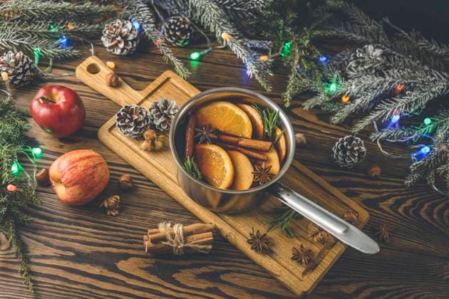 Christmas mulled red wine with the addition of spices and citrus Christmas mulled red wine with the addition of spices and citrus fruits in a small metal pan on a rustic wooden table, top view. Pot of mulled wine, traditional christmas drink.christmas, spice, wine, alcohol, cinnamon, drink, holiday, red, beverage, warm, anise, hot, orange, pot, sweet, winter, cranberry, festive, punch, celebration, cocktail, decoration, glass, cooking, delicious, food, homemade, apple, aromatic, fir, epicure, fruit, mulled wine, rustic, season, traditional, citrous, eve, merry, rosemary, stick, tradition, xmas, clove, cozy, new year, pan, spruce, still life, berry,  Copyright: xViktoriaxKondysenko (ArtSvitlynax 34795858