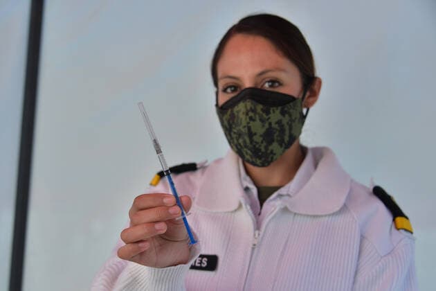 Vaccination Against Covid-19 In Mexico MEXICO CITY, MEXICO - DECEMBER 30: A nurse holds the Pfizer-BioNTech COVID-19 vaccine during the vaccinations against Covid for health workers at tents installed for the vaccination campaign of Covid-19 inside Military Camp 1A on December 30, 2020 in Mexico City, Mexico Copyright: xCarlosxTischlerx EYEPIXGROUP_CT_30122020_3129