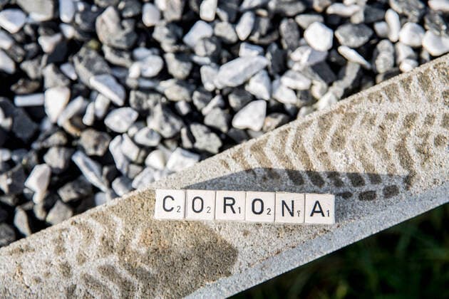 Bamberg, Germany 31 December 2020 The lettering Corona lies on a concrete edge with footprints Bavaria Copyright: xFotostandx xK.xSchmittx