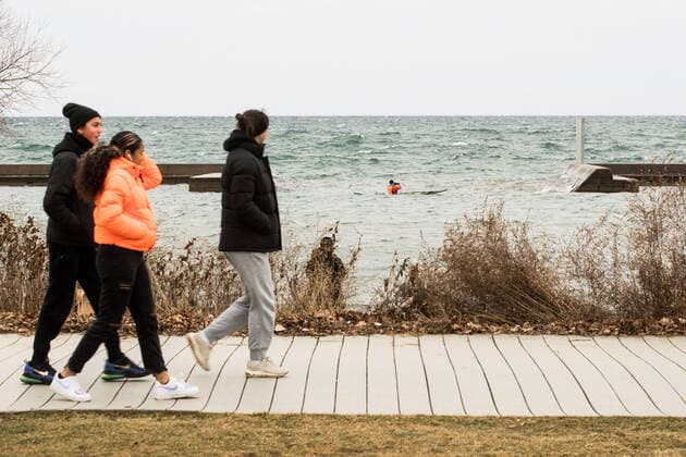 January 1, 2021, Toronto, Ontario, Canada: Pedestrians and a kayaker take in the the sight of a second mysterious metal monolith off Torontos shoreline New Years Day. The structure was anonymously placed on the breakwall in the early hours of 2021; strategically in direct line of sight of a first column which appeared in a nearby park 24 hours earlier. Toronto Canada - ZUMAs109 20210101_zaf_s109_004 Copyright: xChristopherxDrostx