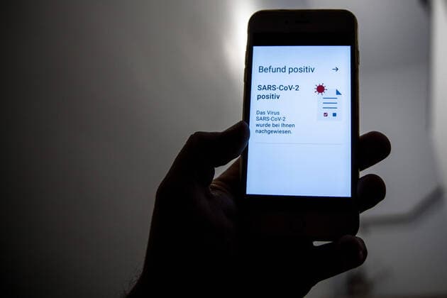 Bamberg, Germany 02 January 2021 A person holds a mobile phone in his hand, on the mobile phone display is a message, finding positive, SARS CoV 2 The virus SARS CoV 2 has been detected in you Bayern Copyright: xFotostandx xK.xSchmittx