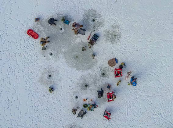January 2, 2021, Fenton Lake, USA: .People kicked off the new year by going ice fishing at Fenton Lake in the Jemez mountains Saturday morning. This was the first day the lake opened for ice fishing. Due to recent cold weather, the lakes ice thickness is now at minimum standards for this access according to New Mexico State Parks officials. Pictured is a group of fishermen in the middle of the lake. Close to 80 folks came out early this morning to try their luck. .Jemez Mountains, New Mexico ABQ Journal Fenton Lake USA - ZUMAab1_ 20210102_zaf_ab1_007 Copyright: xRobertoxE.xRosalesx