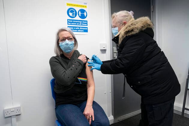 (210107) -- GREATER MANCHESTER, Jan. 7, 2021 -- A member of local healthcare staff receives her second dose of the Pfizer-BioNTech COVID-19 vaccine at Hyde Leisure Centre in Greater Manchester, Britain, on Jan. 7, 2021. British Prime Minister Boris Johnson told MPs on Wednesday that the government will use every available second of the lockdown to place an invisible shield around elderly and vulnerable people through the rollout of COVID-19 vaccines in the coming weeks. (Photo by Xinhua) BRITAIN-GREATER MANCHESTER-COVID-19-VACCINE JonxSuper 