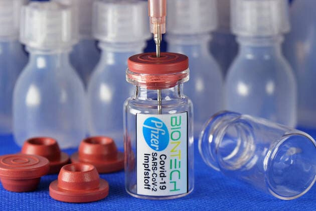 Symbol image Coronaserum vaccine can with syringe Corona vaccine