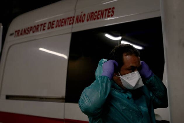 January 8, 2021, Lisbon, Portugal: A healthcare worker dresses a protective suit before carrying a COVID-19 patient at the Curry Cabral Hospital in Lisbon, Portugal, January 8, 2020. Portugal reported today a record 10,176 new COVID-19 cases and 118 deaths in 24 hours, the highest daily figures since the beginning of the pandemic, according to the national health authority Lisbon Portugal - ZUMAf123 20210108_zap_f123_001 Copyright: xPedroxFiuzax