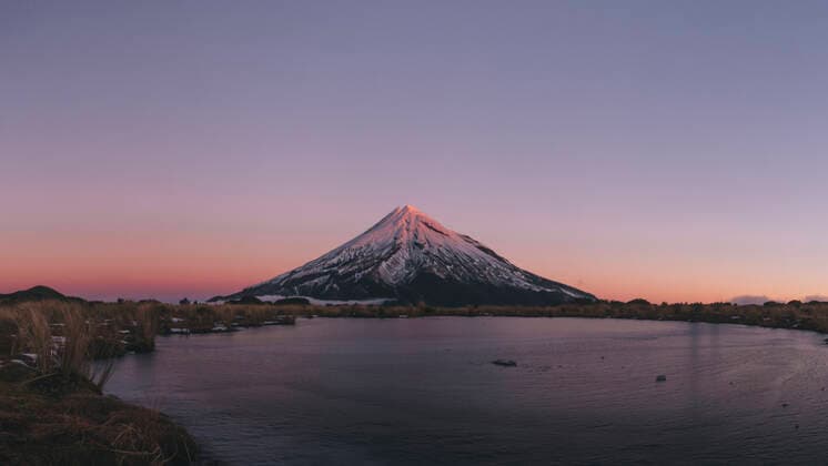 Frozen lake at the foot of Mt Taranaki during late sunset, New Zealand. New Plymouth, Taranaki, New Zealand CR_JALO210108-595359-01