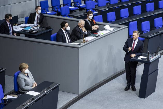 Christian Lindner R , FDP party leader, and Angela Merkel L , German Chancellor, recorded during a debate in the German Bundestag on the start of vaccination in Germany and Europe in Berlin, 13 01 2021 Berlin Germany Copyright: xFlorianxGaertner photothek.dex