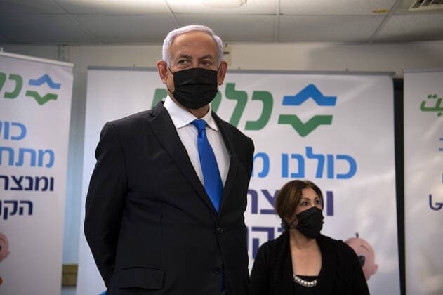 Israeli Prime Minister Benjamin Netanyahu visits the anti-coronavirus vaccination facility in the northern Arab city of Nazareth, Israel, on January 13, 2021. Pool photo by Gil Eliyahu  JERX20210113202 GilxEliyahu