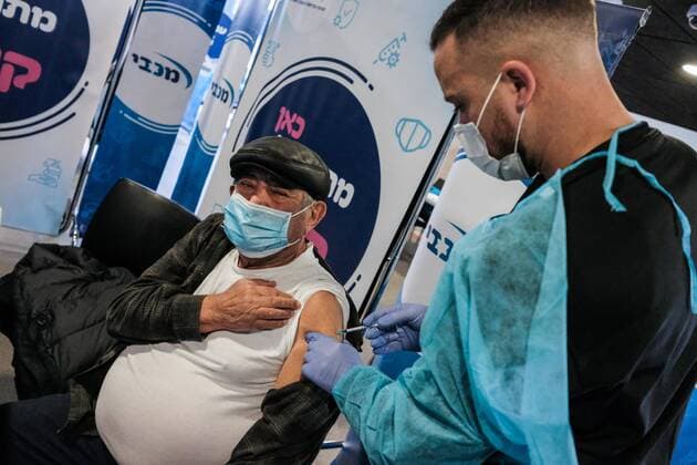 January 14, 2021, Jerusalem, Israel: Nurses administer COVID-19 vaccines at the Pais Arena Sports Complex in Jerusalem, converted into a Coronavirus vaccination center. Criteria is now either health workers, education workers, or the general public 50 years of age and above. The number of Israeli citizens who have received at least one dose of the Pfizer BioNTech vaccine has exceeded 2M as a mass vaccination campaign continues, and so does COVID-19 infection in the general public. Jerusalem Israel - ZUMAa126 20210114_zap_a126_009 Copyright: xNirxAlonx